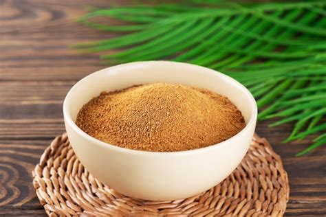 Premium Photo | Unrefined cane sugar panela in a bowl with palm branch ...