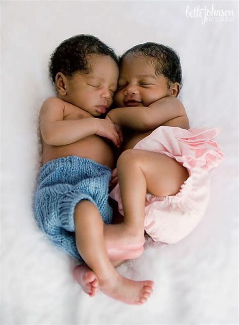 Twin boy/girl newborns. She looks so happy to be cuddled up next to her ...