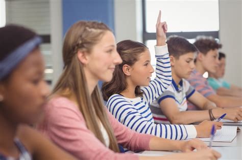 Premium Photo | Student raising hand in classroom