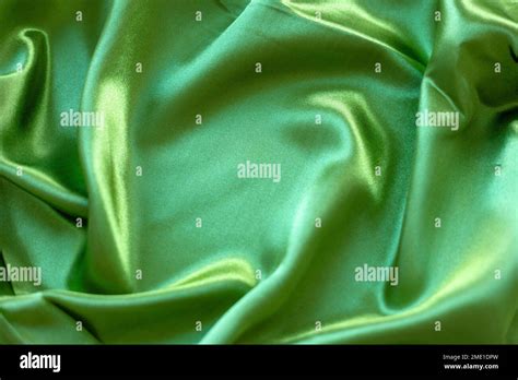 Silk fabric of green color Stock Photo - Alamy