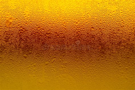 Texture of Water Droplets on Gradient Golden Yellow Lager Beer Glass ...