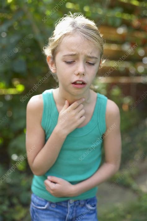 Girl coughing - Stock Image - F002/5896 - Science Photo Library