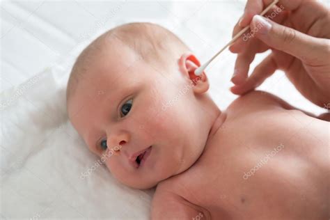 Mother Cleaning Baby Ear Stock Photo by ©AndreyPopov 115964176