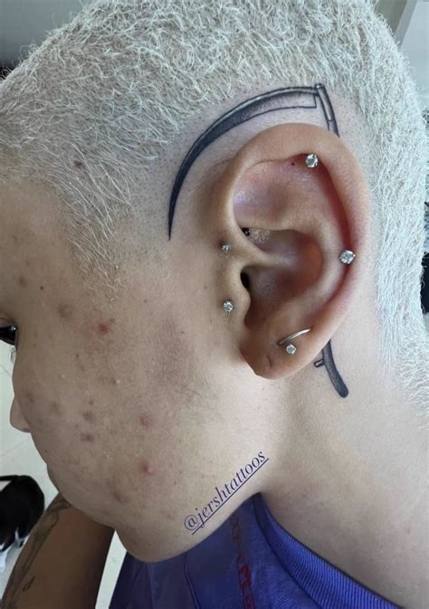 Doja Cat Gets Massive Scythe Tattoo Over Ear