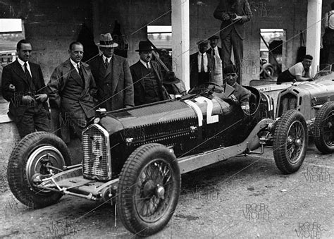 Tazio Nuvolari seated in his Alfa Romeo on the Reims-Gueux