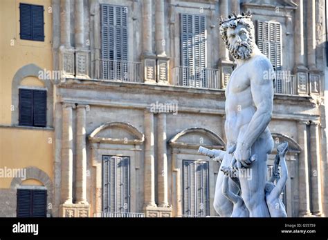 Statue of Neptune above the fountain in the Piazza della Signoria ...