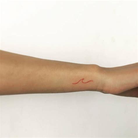 Minimalist red ink tattoo on the wrist. | Finger tattoos, Wrist tattoos ...