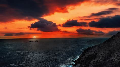 Sunsetting Over Boat 4K Wallpaper