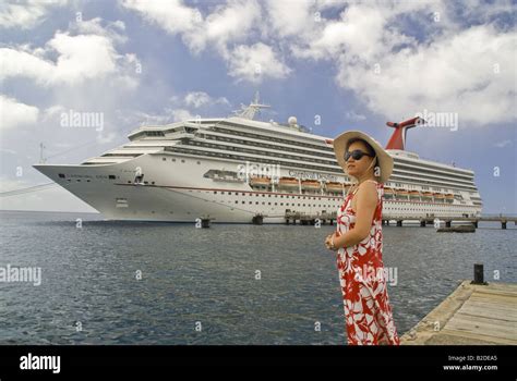 Carnival Destiny cruise ship in Caribbean island port of Roseau ...