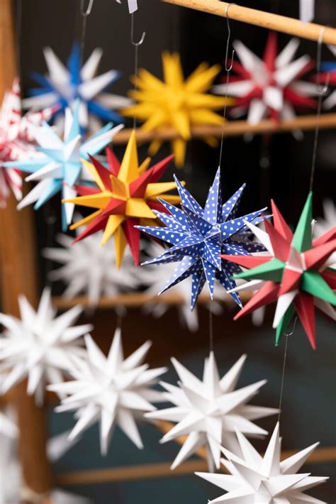 several colorful paper stars hanging from strings