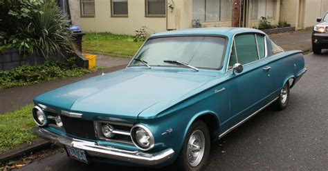 OLD PARKED CARS.: 1964 Plymouth Barracuda.