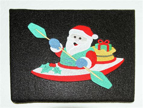 Santa Claus Paddling Kayak Photograph by Sally Weigand - Fine Art America