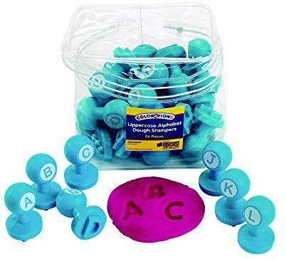 blue and pink balls in a plastic container with the word abc on it's side