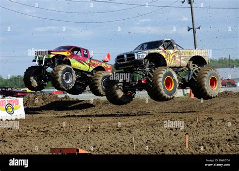 Monster Trucks race at freestyle competition at 4x4 Off-Road Jamboree ...