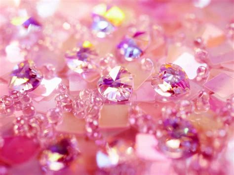 Download A dazzling pink diamond glistening against a light grey ...