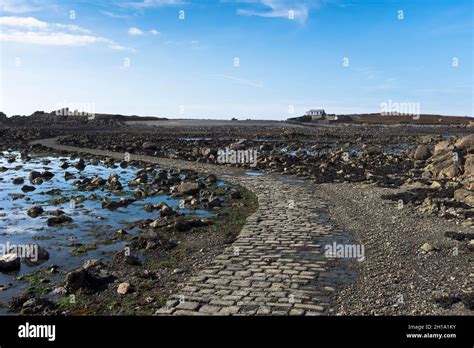 dh LIHOU ISLAND GUERNSEY Causeway to islands building Stock Photo - Alamy