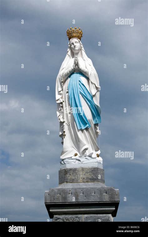 FRANCE, LOURDES. Statue of Our Lady of Lourdes in the sanctuary of ...