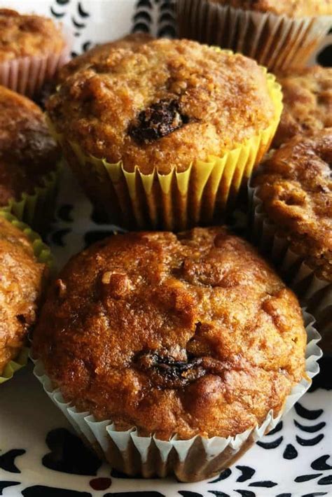 several muffins on a black and white plate