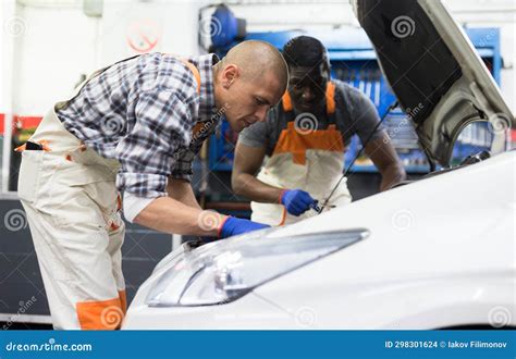 Positive Man Car Mechanician Repairing Car in Auto Repair Service Stock ...