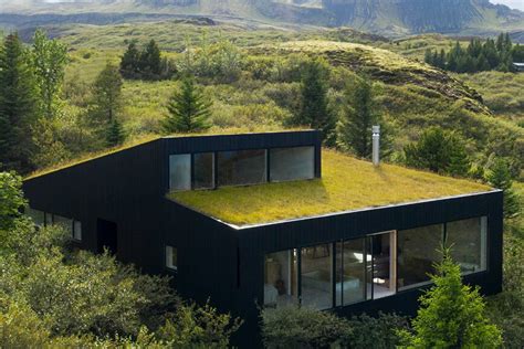 The green roof of this holiday home was designed to blend in seamlessly ...