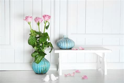 Premium Photo | Home decor and roses on wooden background