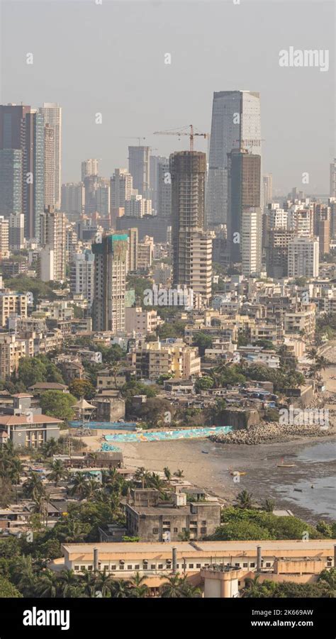 An aerial view of cityscape Mumbai surrounded by buildings and water ...