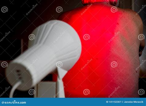 Infrared radiation therapy stock image. Image of medicine - 141152307