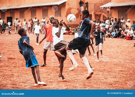 Black African Children, Boys and Adults Playing Soccer Editorial Image ...