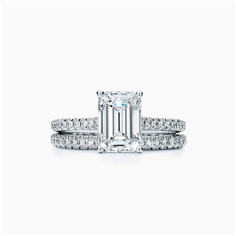 Tiffany Novo® emerald-cut engagement ring with a pavé diamond band in ...