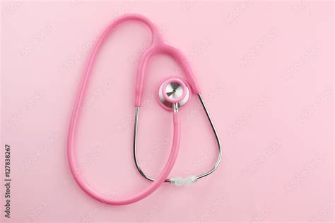 Pink stethoscope on pink background Stock Photo | Adobe Stock