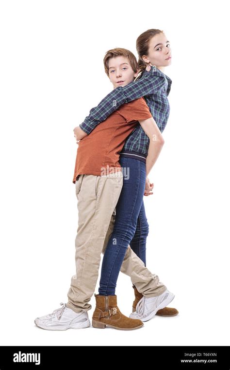 teenager siblings hugging back on back, isolated on white Stock Photo ...