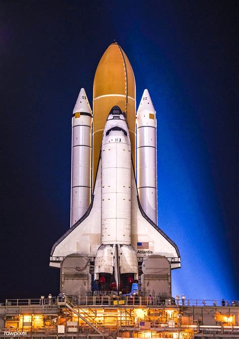 Space shuttle Atlantis, attached to its bright-orange external fuel ...