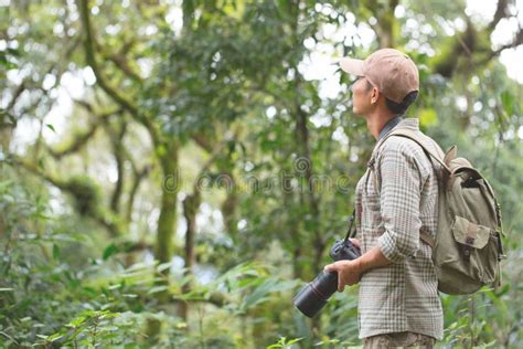 Thoughtful Young Man Using Camera while Hiking in Nature, Hiking Stock ...