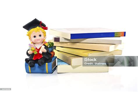 Graduation Resin Doll And Books Stock Photo - Download Image Now - Book ...