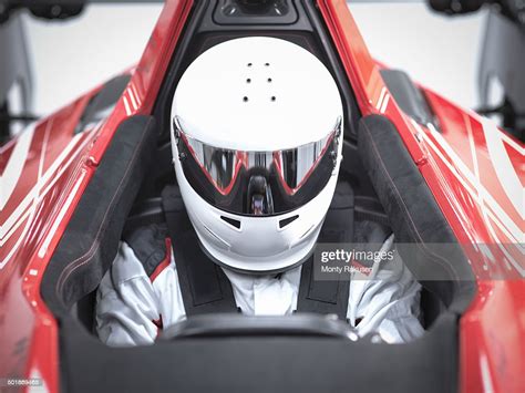 Racing Driver Wearing Crash Helmet In Supercar High-Res Stock Photo ...