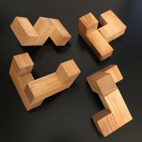 Stewart Coffin's Puzzle Design #93; the Four Piece Interlocking Cube