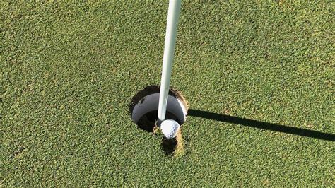 Is this golf ball embedded in the cup a hole-in-one? Here's what we learned