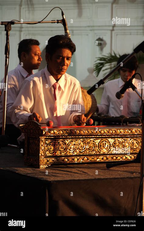 Thai musician performing a Ranat Ek (traditional Thai xylophone Stock ...