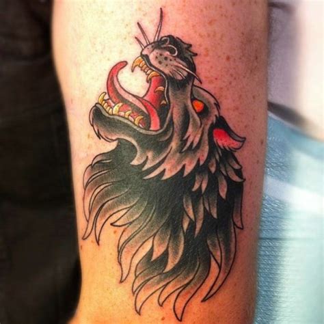 Old school colored demonic wolf tattoo on arm - Tattooimages.biz