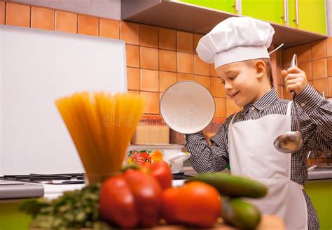 Boy Chef is Cooking in the Kitchen Stock Photo - Image of kitchen, chef ...