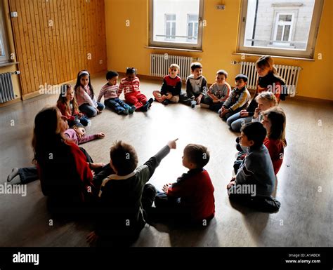 Children sit in the circle in a nursery Stock Photo - Alamy