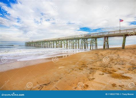 Flagler Beach with Pier and American Flag Stock Image - Image of sand ...