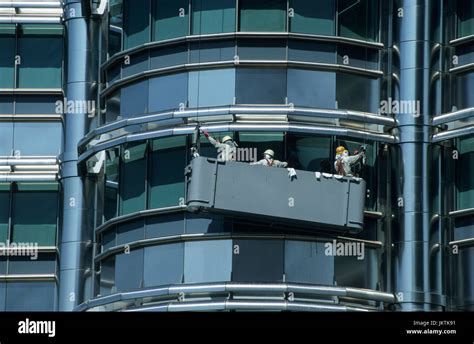 MALAYSIA, Kuala Lumpur, twin towers Petronas Tower, window cleaner at ...