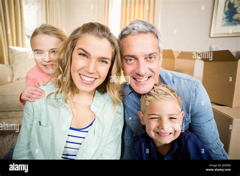 Happy family smiling Stock Photo - Alamy