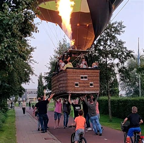 Heroic bystanders save hot air balloon from crashing into school