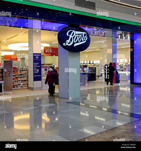 People in Boots pharmacy chemist shop front & interior in Westfield ...