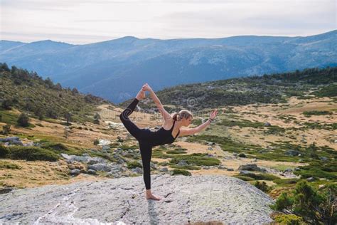 Yoga poses woman mountain stock image. Image of training - 238390663