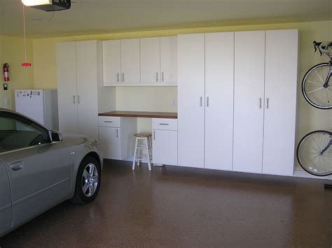 Garage cabinets in white laminate finish, workbench, bike storage, and ...