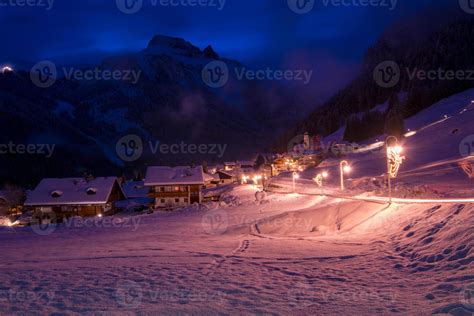 mountain village in alps at night 10767062 Stock Photo at Vecteezy