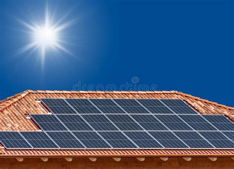 Roof with Solar Panels on Blue Sky with Sun Rays Stock Image - Image of ...